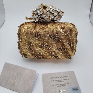 Jimmy choo crystal embellished cloud clutch in color gold